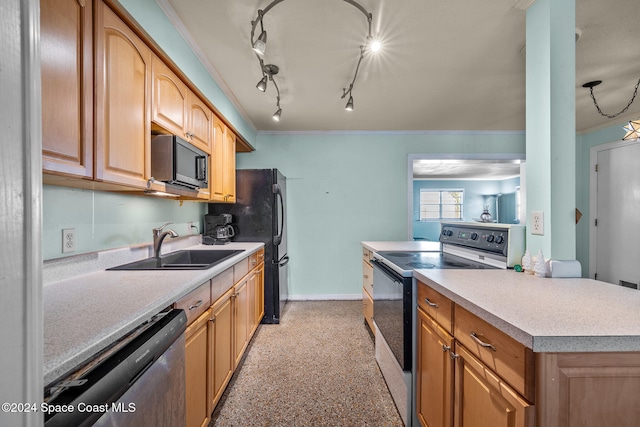 kitchen with a center island, track lighting, black appliances, crown molding, and sink