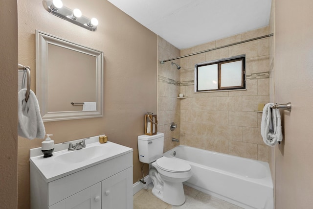 full bathroom with tiled shower / bath, vanity, toilet, and tile patterned floors