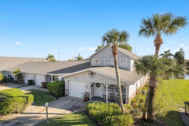 view of front facade with a front yard and a garage