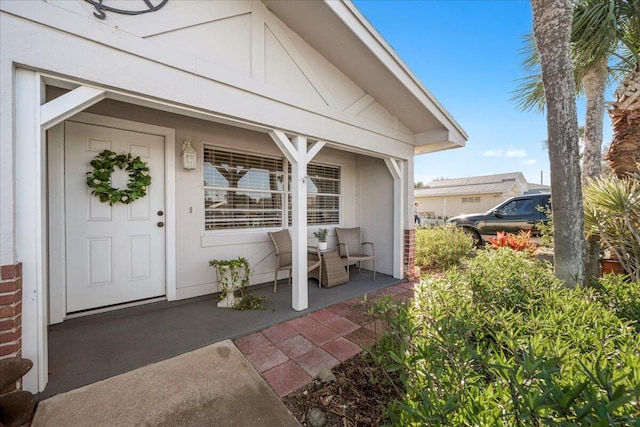 doorway to property featuring a patio area