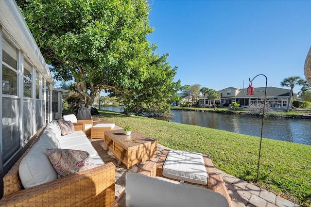 view of patio / terrace featuring a water view and outdoor lounge area