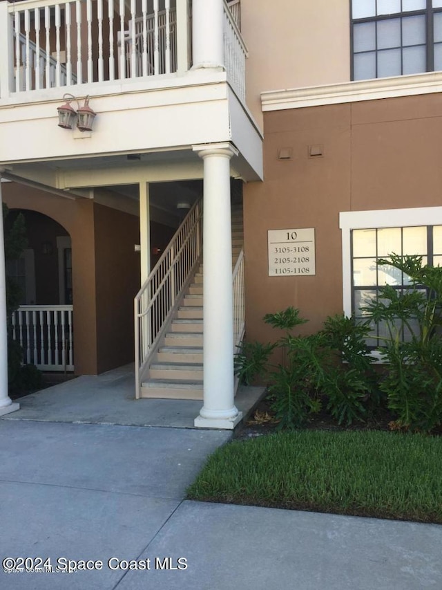 6470 Borasco Dr Unit 1108, Melbourne, FL 32940 - doorway to property with stucco siding