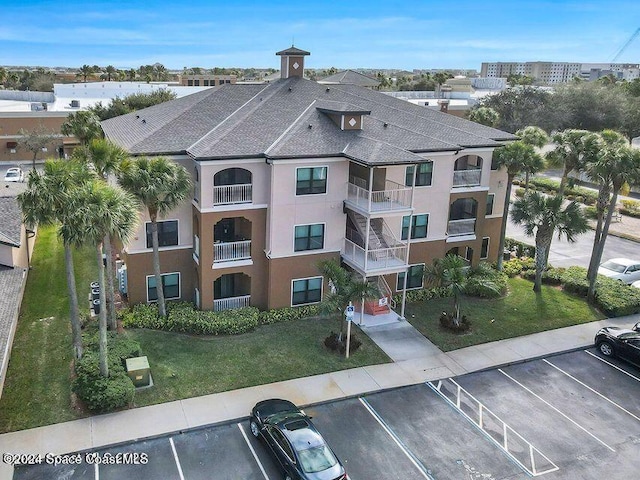 6470 Borasco Dr Unit 1108, Melbourne, FL 32940 - view of building exterior featuring uncovered parking