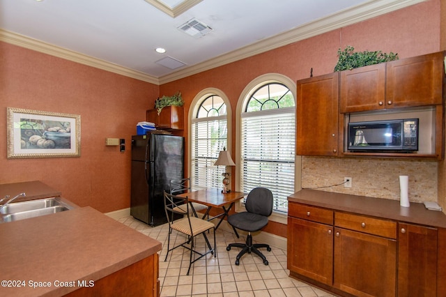 home office with crown molding and sink