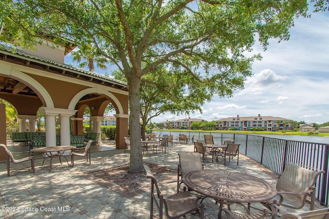 view of patio with a water view