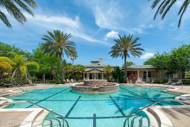 view of swimming pool featuring a patio