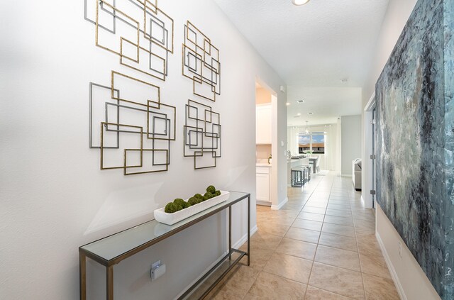 corridor with light tile patterned floors