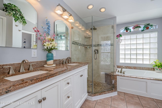 bathroom with vanity, plus walk in shower, and tile patterned floors