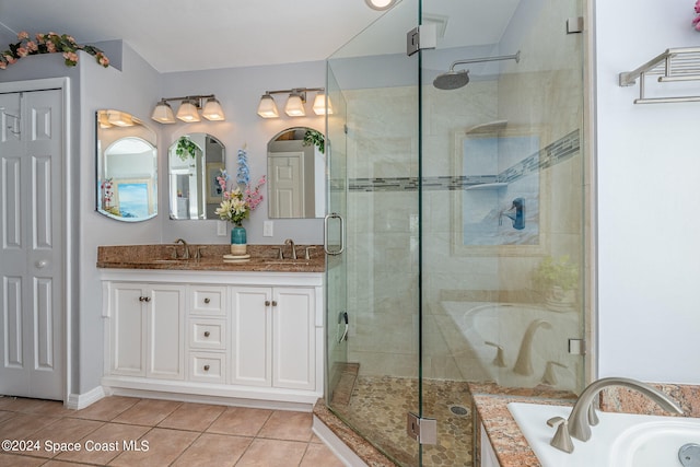 bathroom with vanity, shower with separate bathtub, and tile patterned floors