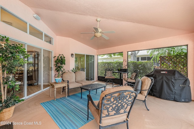 sunroom / solarium featuring ceiling fan and lofted ceiling