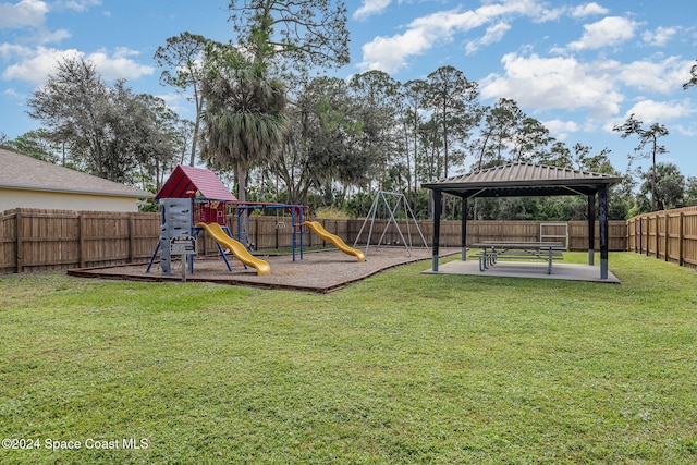 view of play area with a gazebo and a lawn