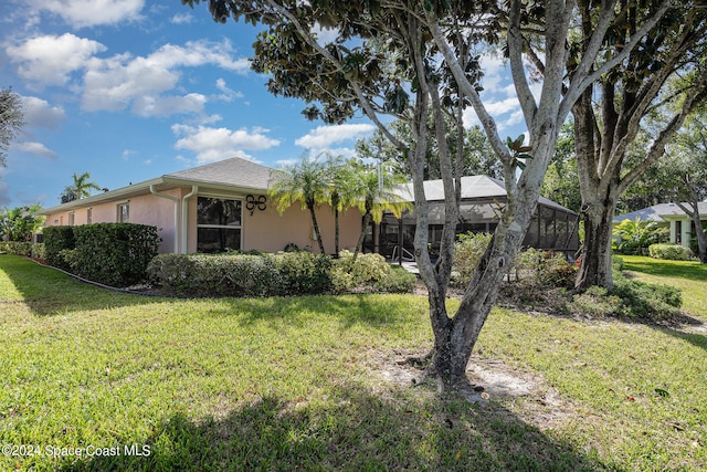 view of property exterior with a lawn