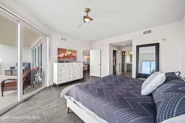 bedroom featuring ensuite bath and ceiling fan