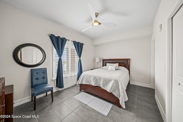 bedroom with tile patterned flooring and ceiling fan