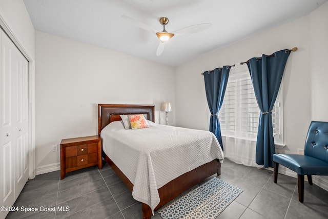 tiled bedroom featuring a closet and ceiling fan