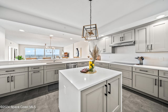 kitchen featuring stainless steel dishwasher, pendant lighting, a chandelier, a center island, and gray cabinets