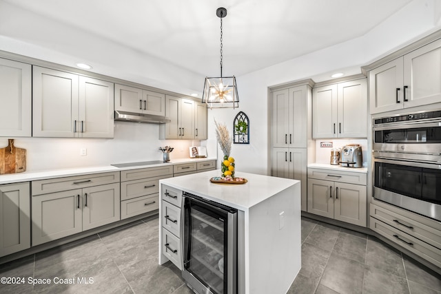 kitchen with a center island, hanging light fixtures, wine cooler, gray cabinets, and stainless steel double oven