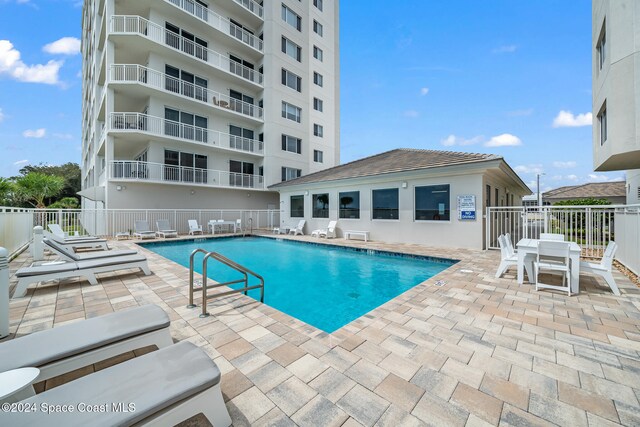 view of pool featuring a patio