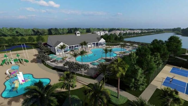 birds eye view of property with a water view