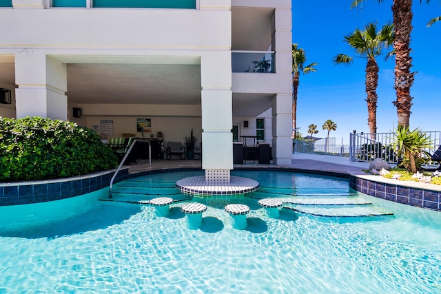 view of pool featuring a patio area