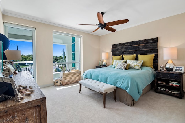 bedroom featuring access to outside, ornamental molding, light colored carpet, and ceiling fan