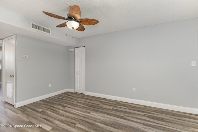 spare room featuring hardwood / wood-style floors, a textured ceiling, and ceiling fan