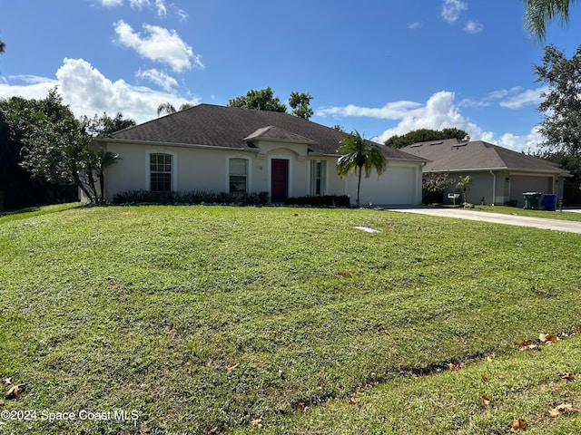 single story home with a front yard and a garage