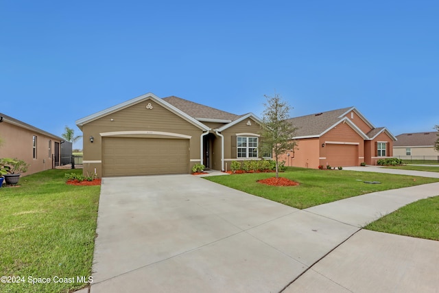 single story home with a garage and a front yard