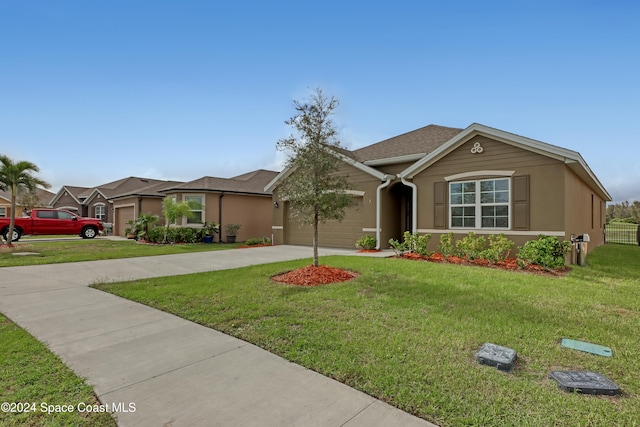 view of front facade with a garage and a front yard