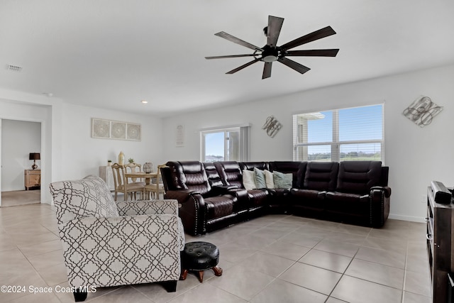 living room with light tile patterned flooring and ceiling fan