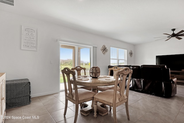 dining room with light tile patterned flooring and ceiling fan