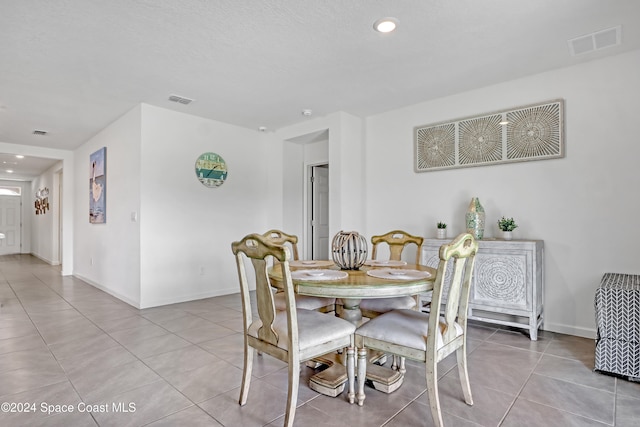 dining room with light tile patterned flooring