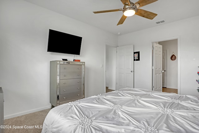 bedroom with light colored carpet and ceiling fan