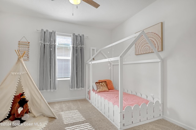 carpeted bedroom featuring ceiling fan