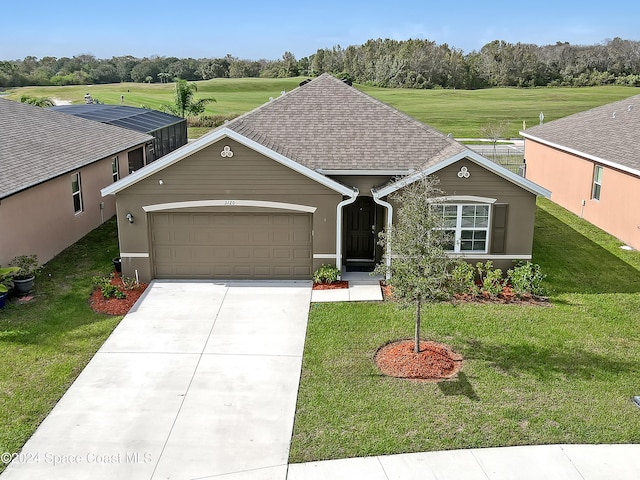 view of front of home with a garage and a front yard