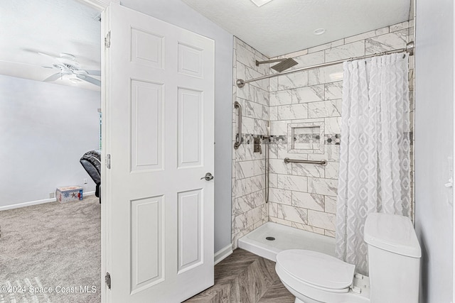 bathroom with ceiling fan, a textured ceiling, toilet, parquet flooring, and curtained shower