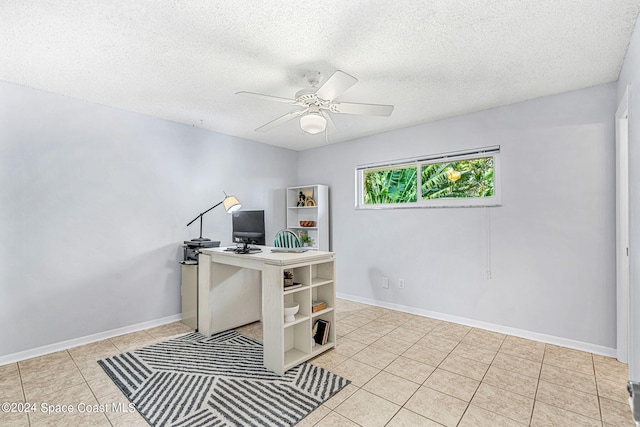 tiled home office with a textured ceiling and ceiling fan