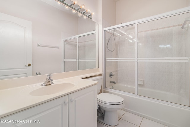 full bathroom with vanity, enclosed tub / shower combo, toilet, and tile patterned flooring