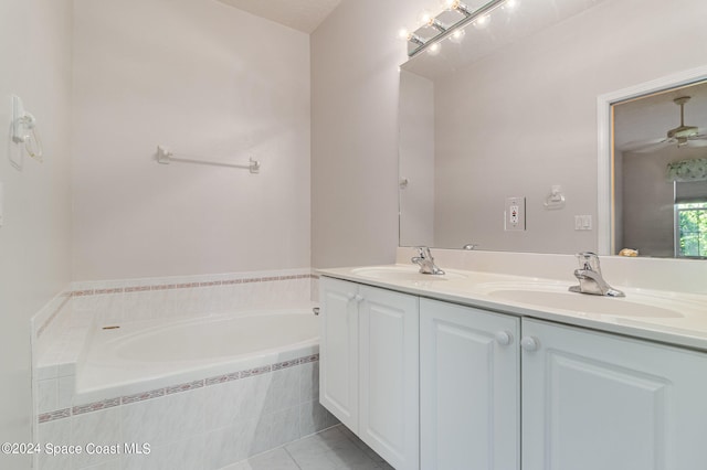 bathroom featuring vanity, tiled bath, tile patterned floors, and ceiling fan