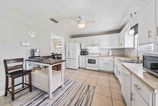 kitchen with white appliances, sink, ceiling fan, light tile patterned floors, and white cabinetry