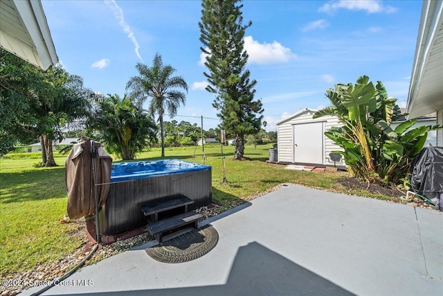 view of patio / terrace featuring a hot tub and a shed