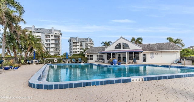 view of swimming pool featuring a patio