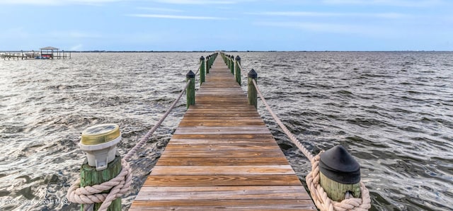 view of dock with a water view