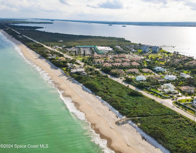 drone / aerial view with a view of the beach and a water view