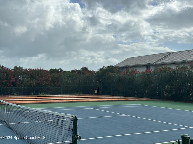 view of sport court featuring basketball hoop