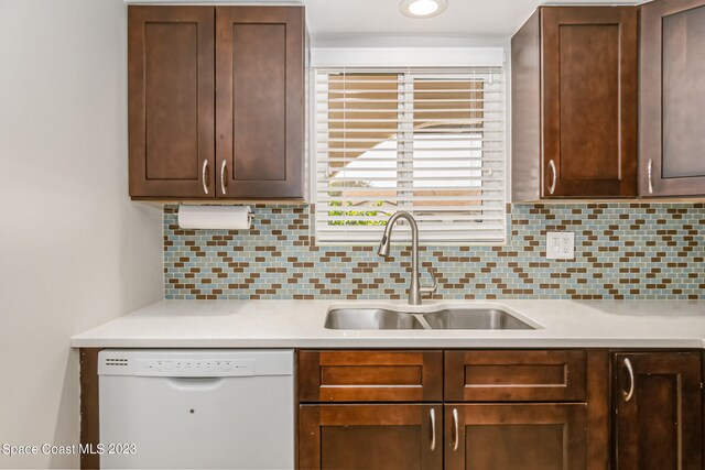 kitchen featuring sink, dishwasher, and tasteful backsplash