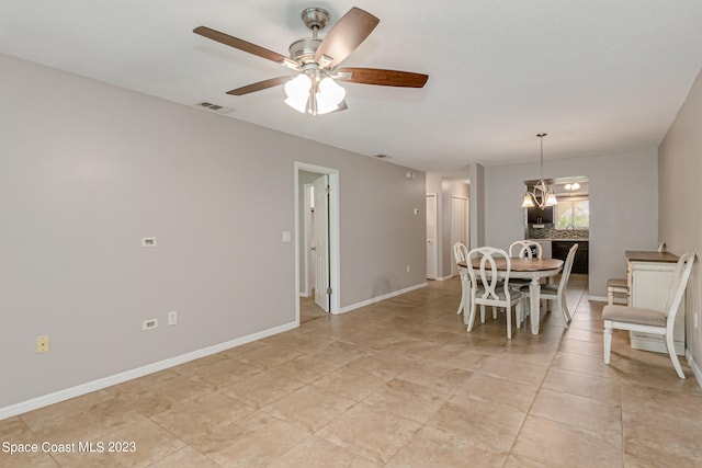 dining area featuring ceiling fan and light tile patterned flooring