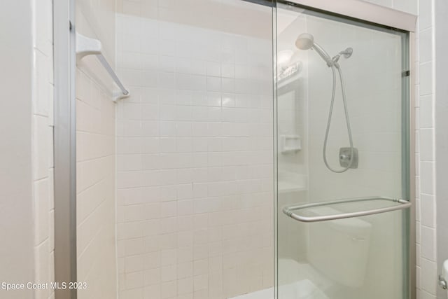 bathroom featuring an enclosed shower