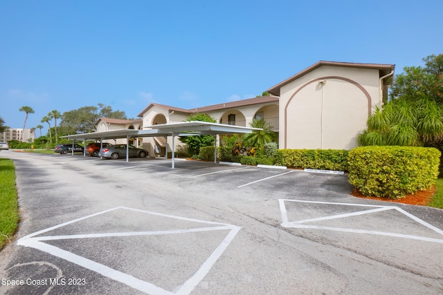 view of parking featuring a carport