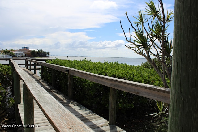 surrounding community featuring a water view